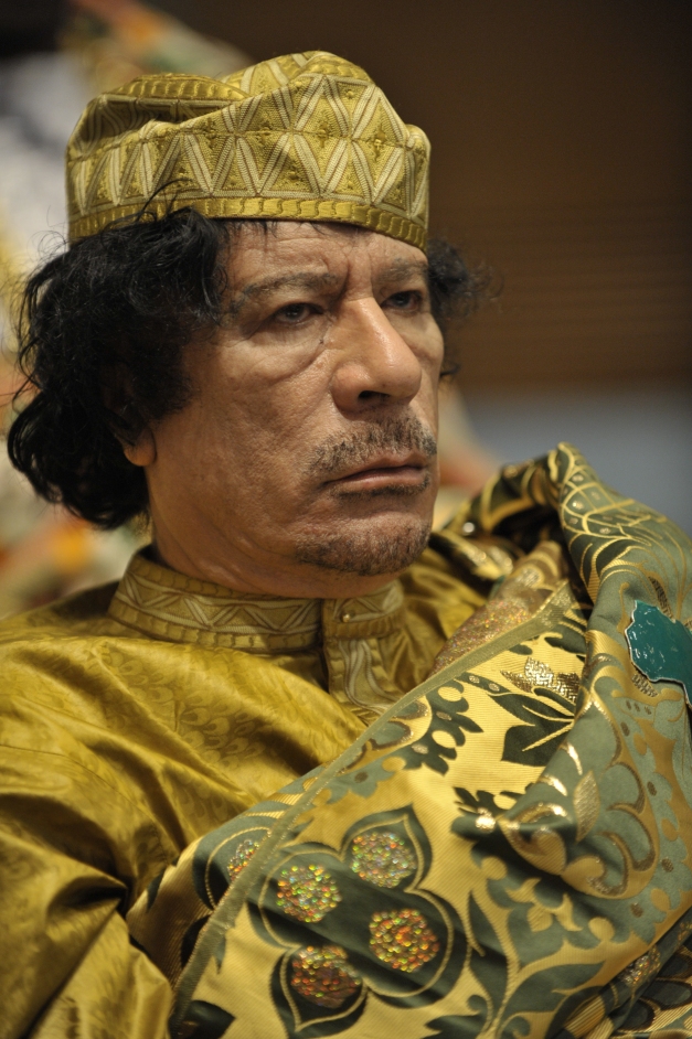 Muammar Gaddafi, Leader of the Revolution of the Great Socialist PeopleÕs Libyan Arab Jamahiriya, sits reading in the Plenary Hall of the United Nations (UN) building in Addis Ababa, Ethiopia, during the 12th African Union (AU) Summit